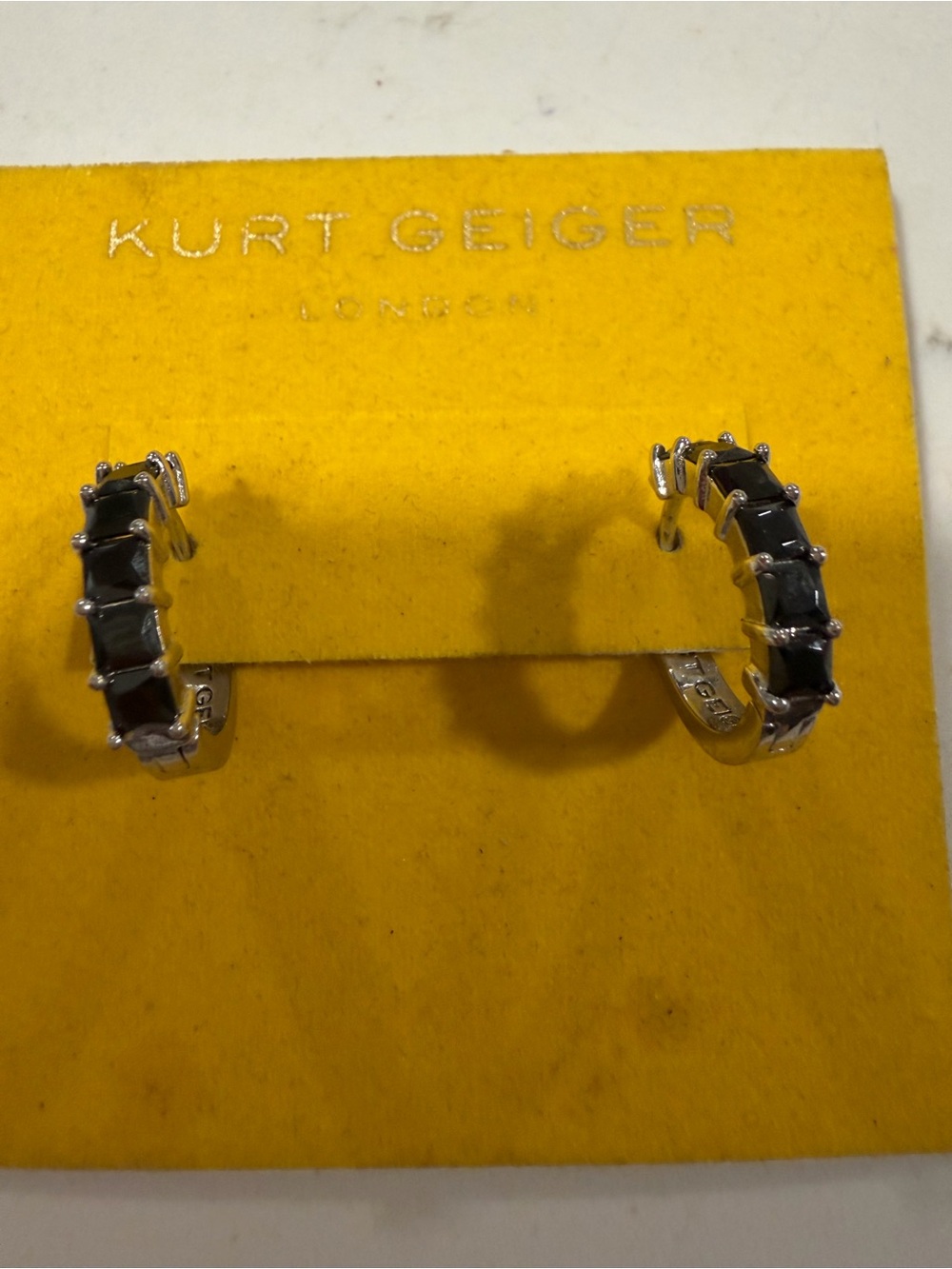 Kurt Geiger Silver Hoop Earrings with Black Stones